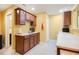 Wet bar area featuring brown cabinets, countertops, sink and beverage storage at 2920 Stanway Ave, Douglasville, GA 30135