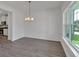 Open dining area with natural light, complemented by the hardwood flooring at 4140 Chapel Hill Reserve, Douglasville, GA 30135