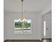 Dining room featuring stylish chandelier and a large window with a view at 4140 Chapel Hill Reserve, Douglasville, GA 30135
