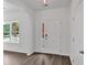 Bright entryway with wood-look floors and a window providing natural light at 4140 Chapel Hill Reserve, Douglasville, GA 30135