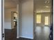 Bright entryway with hardwood floors leading to the kitchen and living area at 4140 Chapel Hill Reserve, Douglasville, GA 30135