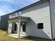 Exterior view of a home with gray siding and a covered patio, showcasing its backyard at 4140 Chapel Hill Reserve, Douglasville, GA 30135