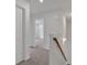 Hallway with carpet floor, a wooden railing and access to other rooms at 4140 Chapel Hill Reserve, Douglasville, GA 30135
