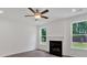 Inviting living room featuring a fireplace and large windows for natural light at 4140 Chapel Hill Reserve, Douglasville, GA 30135