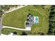 Aerial view of large estate with pool, black fence line, expansive yard and modern farmhouse at 445 Roper Rd, Canton, GA 30115