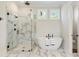 This modern bathroom features a large soaking tub, a glass shower stall and double sinks at 445 Roper Rd, Canton, GA 30115