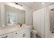 Well-lit bathroom featuring modern vanity, mirror, and a shower-over-tub with stylish tile and fixtures at 445 Roper Rd, Canton, GA 30115