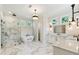 This modern bathroom features double sinks, a soaking tub, a walk-in shower, and unique modern lighting at 445 Roper Rd, Canton, GA 30115