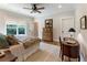 Inviting bedroom featuring warm tones, wood floors, and a comfortable bed with plenty of pillows at 445 Roper Rd, Canton, GA 30115