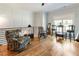 This home's upstairs bonus room features a sitting area, hardwood floors and a view of the outdoors at 445 Roper Rd, Canton, GA 30115