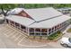 Charming building with a metal roof, covered porch, and inviting outdoor seating at 445 Roper Rd, Canton, GA 30115