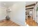 Bright foyer with a hall tree and bench, with hardwood floors and access to the open concept living spaces at 445 Roper Rd, Canton, GA 30115