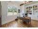 Inviting home office with built-in bookshelves and a large window offering natural light and scenic views at 445 Roper Rd, Canton, GA 30115