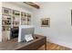 Comfortable home office with decorative lighting, wooden desk and a view of the property's exterior at 445 Roper Rd, Canton, GA 30115