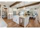 Bright kitchen with hardwood floors, stainless steel appliances and large center island at 445 Roper Rd, Canton, GA 30115