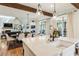 Open concept kitchen and dining area with hardwood floors, modern appliances and lots of light at 445 Roper Rd, Canton, GA 30115