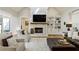 Cozy living room with a brick fireplace, built-in shelves, and comfortable seating at 445 Roper Rd, Canton, GA 30115