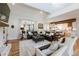 Spacious living room with hardwood floors, a brick fireplace, and an open-concept design at 445 Roper Rd, Canton, GA 30115