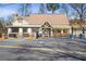 Quaint restaurant with outdoor seating and a welcoming facade at 445 Roper Rd, Canton, GA 30115