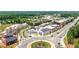 Aerial view of a vibrant town center with well-designed buildings and a roundabout at 445 Roper Rd, Canton, GA 30115