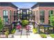 Inviting town center featuring outdoor dining, attractive architecture, and lush landscaping at 445 Roper Rd, Canton, GA 30115