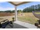 A covered patio area in a spacious backyard, offering a relaxing outdoor space at 1961 Vidalia Ct, Dacula, GA 30019