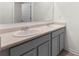 Bathroom vanity with double sinks and chrome faucets, providing ample space and modern convenience at 1961 Vidalia Ct, Dacula, GA 30019