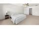 Bright bedroom featuring neutral carpet, ceiling fan, and an ensuite bathroom at 1961 Vidalia Ct, Dacula, GA 30019