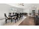 Open concept dining and kitchen area with dark wood floors and a large table at 1961 Vidalia Ct, Dacula, GA 30019