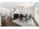 Dining area featuring hardwood floors, a modern ceiling fan, and natural light at 1961 Vidalia Ct, Dacula, GA 30019