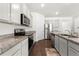 Modern kitchen featuring stainless steel appliances, granite countertops, and ample cabinet space at 1961 Vidalia Ct, Dacula, GA 30019