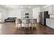 Kitchen featuring bar stool seating, gray cabinets, stainless steel appliances, and an open layout at 1961 Vidalia Ct, Dacula, GA 30019