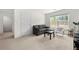Cozy living room with gray couch, a chair, a black table, and natural light at 1961 Vidalia Ct, Dacula, GA 30019