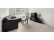 Inviting living area with a sofa, white chair, a black table, and entertainment setup at 1961 Vidalia Ct, Dacula, GA 30019