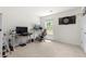 Bright open office space with neutral carpet, and desk at 1961 Vidalia Ct, Dacula, GA 30019