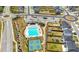 Aerial view of the community pool, tennis courts, playground and surrounding landscape at 1961 Vidalia Ct, Dacula, GA 30019