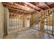 Unfinished basement with exposed ceiling, concrete walls and floor ready for customization at 3900 Ivy Cottage Dr, Snellville, GA 30039