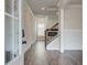Inviting foyer with hardwood floors, paneled walls, and stairs leading to the second floor at 3900 Ivy Cottage Dr, Snellville, GA 30039