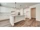 Modern kitchen featuring white cabinets, granite countertops, and a center island at 3900 Ivy Cottage Dr, Snellville, GA 30039