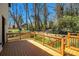 Enjoy outdoor living on this wooden back deck with beautiful backyard views and stylish railings at 608 S Evelyn Nw Pl, Atlanta, GA 30318