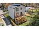 Expansive backyard showcasing a modern two-story home with a private wooden deck and lush green lawn at 608 S Evelyn Nw Pl, Atlanta, GA 30318
