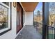 Private covered balcony boasting an outdoor lounge area with neighborhood views at 608 S Evelyn Nw Pl, Atlanta, GA 30318