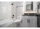Contemporary bathroom with white marble wall tile, soaking tub, and single vanity at 608 S Evelyn Nw Pl, Atlanta, GA 30318