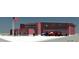Exterior view of the new Grove Park Fire Station, featuring red brick facade and American flag at 608 S Evelyn Nw Pl, Atlanta, GA 30318