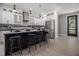 Modern kitchen with white cabinets, stainless steel appliances, and a stylish island with seating at 608 S Evelyn Nw Pl, Atlanta, GA 30318