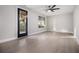 Empty living room features a ceiling fan and luxury vinyl floors at 608 S Evelyn Nw Pl, Atlanta, GA 30318