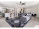 Open-concept living room featuring a stylish sofa, modern decor, and plenty of natural light at 608 S Evelyn Nw Pl, Atlanta, GA 30318