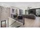 Stylish living room with sleek fireplace, hardwood floors, and modern decor at 608 S Evelyn Nw Pl, Atlanta, GA 30318