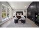 The main bedroom is bright with a large window, modern accents, and hardwood floors at 608 S Evelyn Nw Pl, Atlanta, GA 30318