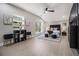 This main bedroom features high ceilings, light hardwood floors, and large windows at 608 S Evelyn Nw Pl, Atlanta, GA 30318